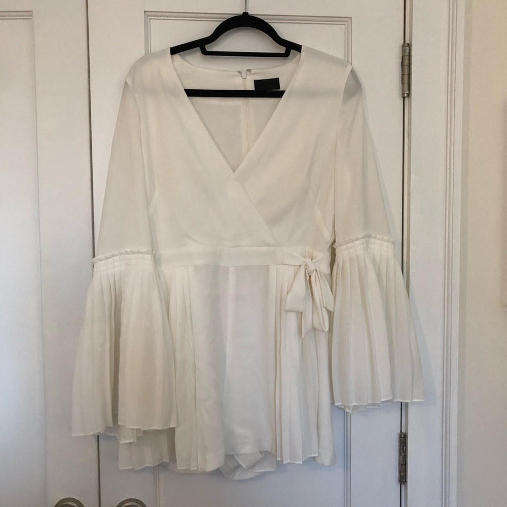 White romper with flared sleeves